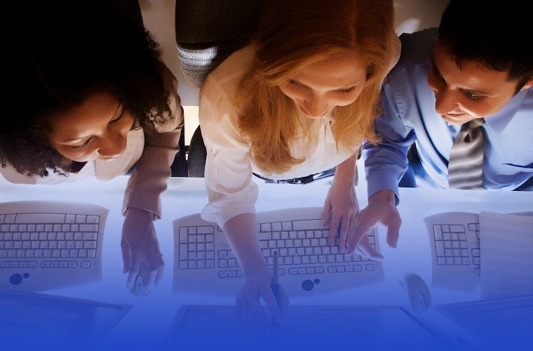 Teamwork: employees and computers 